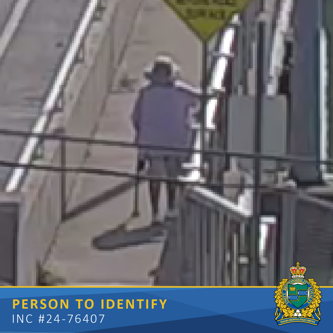 Close up of an elderly woman crossing a bridge. Text Reads Person to Identify