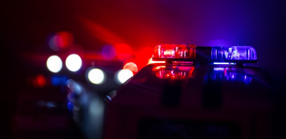 Police lights from the top of a cruiser at night